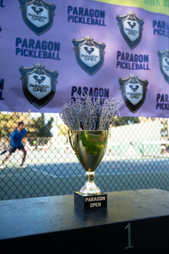 Paragon Open trophy with lavender on a branded backdrop